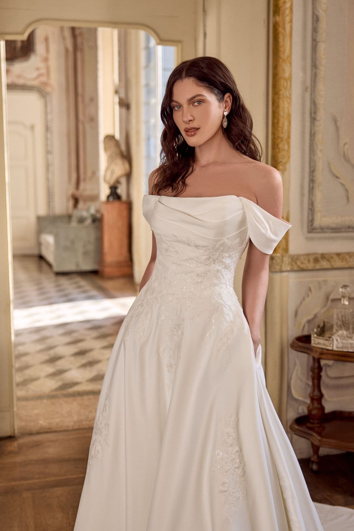 Larissa by Justin Alexander, a bridal gown on a sunlit terrace