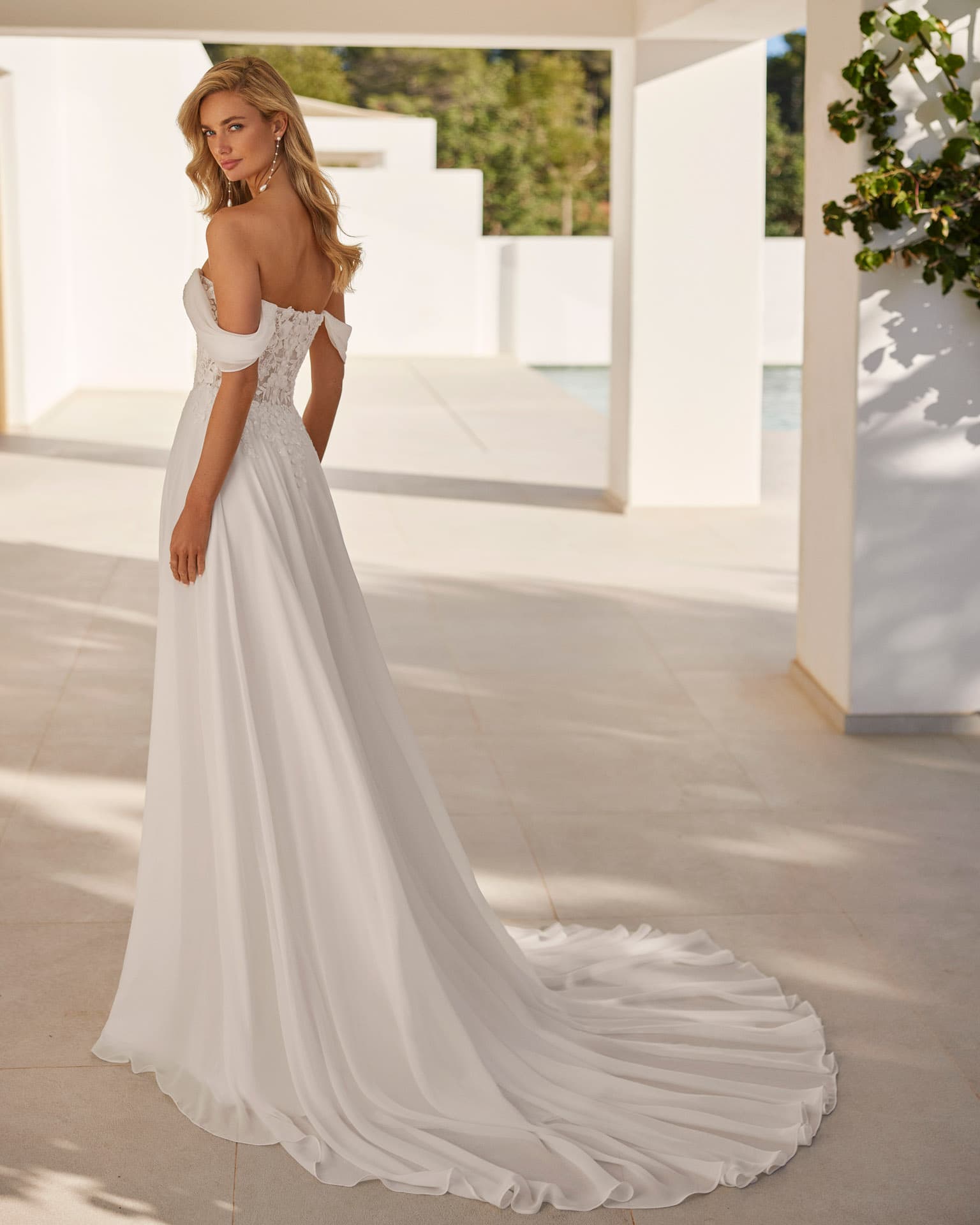 Editorial campaign portrait of a bride in a considered gown